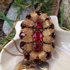 An Absolutely Gorgeous 1920's/30's Ruby Red Czech Glass Pendant With A 12kt Gold Fill Chain. This Fabulous Flapper Era Find Features 15 Large Facet Cut, Prong Set Ruby Red Stones Set Off By 12 Exquisitely Detailed Gold Fill Leaves. Set On A 24" 12kt Gold Fill Chain This Pendant Is 3" By 2". It Is A Magnificent Antique Piece. In Fine Antique Condition. Flapper Era, Vintage Jewellery Rings, Red Stones, Red Stone, Gold Filled Chain, Glass Pendant, Ruby Red, Stone Settings, Glass Pendants