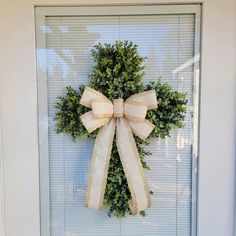 a wreath is hanging on the front door