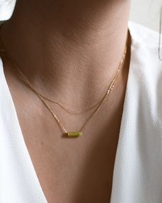 "𝗘𝗮𝘀𝘆 𝗧𝗼 𝗦𝘁𝘆𝗹𝗲, 𝗠𝗮𝗱𝗲 𝗧𝗼 𝗟𝗮𝘀𝘁 Our dainty jade gemstone necklaces are easy to layer and ready to be worn on repeat! Created to last a lifetime, these necklaces will remain evergreen even as the years and trends come and go. 𝗠𝗮𝘁𝗲𝗿𝗶𝗮𝗹𝘀 𝗪𝗲 𝗨𝘀𝗲 This necklace is made entirely with sturdy 14k yellow gold filled or sterling silver pieces and a genuine gemstone pendant. It is safe to wear in the shower, but we recommend avoiding prolonged exposure to chemicals like chlorine to keep your necklace like new! Our jade gemstones are not dyed or artificially colored in any way. The stones and their colors are completely genuine! 𝗟𝗲𝗻𝗴𝘁𝗵 𝗢𝗽𝘁𝗶𝗼𝗻𝘀 We have lengths between 14\" - 20\" available! Generally, we recommend 14\" length for children, someone with a very Dainty Gold Jade Necklace, Minimalist Gold Jade Jewelry, Everyday Gold Jade Jewelry, Dainty Necklaces With Natural Stones For Layering, Minimalist Layered Everyday Jewelry, Green Jewelry With Delicate Chain For Layering, Minimalist Green Beaded Chain Jewelry, Green Minimalist Beaded Chain Jewelry, Minimalist Gold Beaded Necklace With Natural Stones