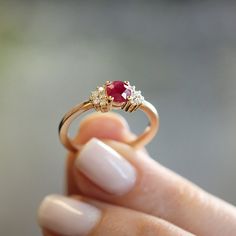 The Julie Ring is a colorful band inlaid with a ruby gemstone center, surrounded by round brilliant diamonds. **Due to the nature of the natural Ruby the color may vary** All features can be customized! please contact us if you wish to make changes, we love making custom designs. All of our jewelry is carefully handmade in our atelier *HC diamond are all conflict free diamonds To order by phone click here>> +972(0)722991000 Nature, Round Ruby Ring Design, Ruby Stone Ring Design Gold, Rings Designs For Women Gold, Simple Ring Designs Gold, Golden Rings Design For Women, Ruby Mangalsutra, Simple Diamond Rings, Gold Ring Design For Women