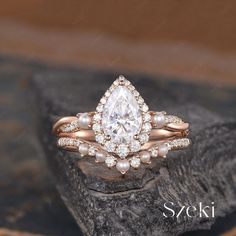 a close up of a ring on top of a rock