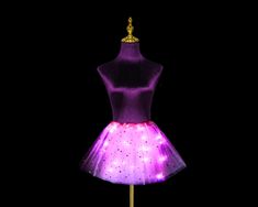 tulle tutu skirt with led lights **Please take note of the Product code when checkout. Tulle Skirt Ballerina Skirt With LED Lights. Perfect for day to night events, festivals, performances. Comes with replaceable batteries and elastic band waist.   Comfy for dancing all night long and perfect outfit to transform whole look!    Product Info   Star Tutus + Matching Colour Light Series (MTSProduct Style/Code: MTS  This series is made from tulle fabric with stars on them and matching colour light. It is longer than the ballerina skirt and it's more of a "skirt" vibe.It has 3 layers of tulle.  (*Also available with plain tulle fabric without stars- Please send a private message/note )  MTS1 Baby Pink + Pink Light MTS2Hot Pink + Pink Light MTS3Yellow + Yellow Light MTS4White + White Light MTS5Re Pride Costume, Led Tutu, Tutu En Tulle, Led Rainbow, Ballerina Skirt, Outfit Festival, Man Outfit, Burning Man Outfits, Tulle Tutu Skirt