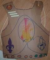 a child's paper bag with a drawing of a fleur de lis on it