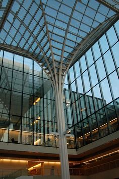 the inside of a building with glass walls