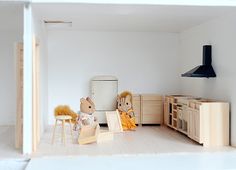 a doll house with furniture and toys in it