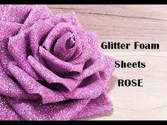 glitter foam sheets and rose on a wooden surface with the words, glitter foam sheets and roses