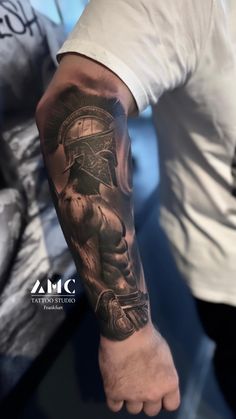 a man with a tattoo on his arm