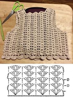 the crochet top is being worked on with scissors