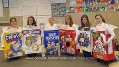 four girls in costumes are holding up some cereal boxes