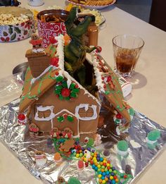 a gingerbread house decorated with candy and decorations