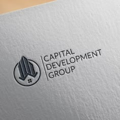 the capital development group logo is displayed on a white paper sheet that reads capital development group