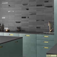 a modern kitchen with grey and yellow accents