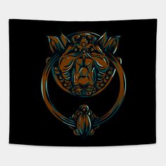 a black and brown wall hanging with an animal head on it's center circle