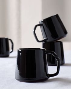 Modern, black Riad Mugs handcrafted in Morocco by master ceramists. Part of the Riad Dinnerware collection by Fairkind. Black Metal Coffee Mug, Black Coffee Mug 6oz, Black Riffle Coffee Mug, Target Black Coffee Mugs, Black Over Size Mug, Matte Mugs, Modern Mugs, Black Mugs, Thrown Pottery