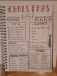 a christmas list with clothes and other things to do for the holiday season, on top of a spiral notebook