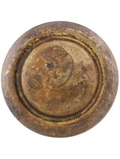 an old round metal object on a white background