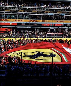 a large flag in the middle of a stadium