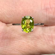 Genuine 1 Carat Peridot Oval Solitaire ~August Birthstone Ring ~ Dainty Engagement / Minimalist Fashion New! Retail Price: $119 Metal: Solid 925 Sterling Silver Finish: High Polish Hallmark: Stamped 925 Stone: Natural Peridot Stone Size: 8x6mm Stone Weight: 1.16 Carats Stone Shape: Oval Multiple Sizes Available August Birthstone Gift Box & Jewelry Cleaning Cloth Included! Perfect Genuine Gemstone Solitaire Ring! Dainty Ring Is A Perfect Everyday Fashion Or Trendy Engagement Ring! The Oval Shaped Oval May Birthstone Gemstone With Center Stone, Classic Peridot Jewelry, Classic Peridot Solitaire Jewelry, Classic Solitaire Peridot Jewelry, Oval Peridot Gemstones For Anniversary, Oval Peridot Birthstone Ring For Anniversary, Oval Peridot Solitaire Jewelry, Oval Peridot Jewelry With Accent Stones, Lime Green Oval Jewelry For May Birthstone