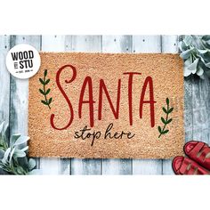 a door mat with the words santa on it