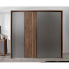 an image of a closet with sliding doors in the living room or bedroom area that is clean and ready for guests to use