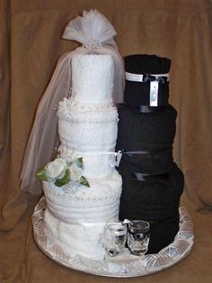 the wedding cake is made up of black and white cloths, which are stacked on top of each other