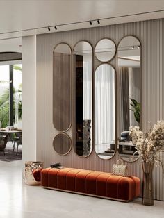 a living room filled with furniture and mirrors