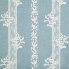 a blue and white striped fabric with an ornate design on the bottom half of it