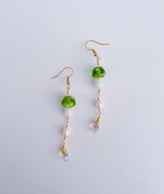 "Stropharia Earrings  3 inch dangle earrings  Made with  fresh water pearls, green lampworkmushroom beads, iridescent teardrop glass beads; as well as anti tarnish wire & 18K gold plated earring hooks. Also available in \"gold\" titanium hypoallergenic earring hooks! DM me on instagram about custom orders! Pearls & glass beads are delicate, please keep jewelry dry & handle with care." Green Mushroom, Mushroom Earrings, Diy Earring, Earring Ideas, Fresh Water Pearls, Earrings Green, Water Pearls, Hypoallergenic Earrings, Earring Hooks