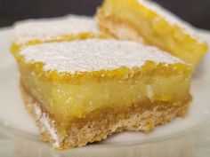 two pieces of dessert sitting on top of a white plate