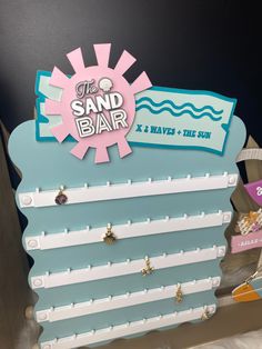 the sand bar sign is made out of cardboard