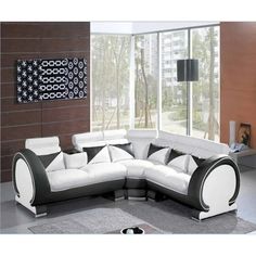 a white and black sectional sofa in a living room