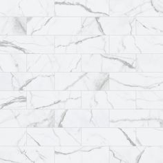 a white marble tile wall with grey veining