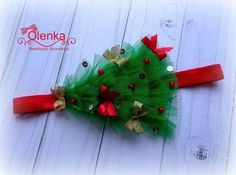 a green christmas tree headband with red bows and sequins on the top