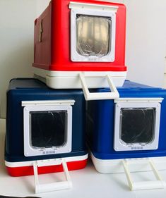 three coolers are stacked on top of each other, one is red white and blue