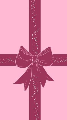 a pink cross with a bow on it