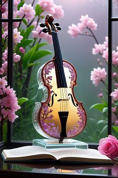 a violin sitting on top of an open book next to flowers and a window sill