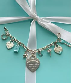 Tiffany and Co. Charm bracelet Tiffany’s Charm Bracelet, Tiffany And Co Outfit Ideas, Jewellery Tiffany And Co, Tiffany And Co Charms, Tifanny And Co Aesthetic, Tiffany And Co Accessories, Tiffany And Co Bracelet Aesthetic, Tiffany’s Bracelet, Tiffany And Co Charm Bracelet