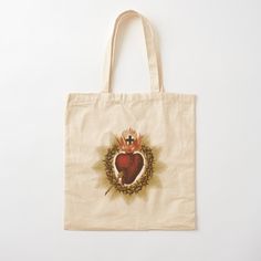 a tote bag with an image of a heart and crown in the middle on it