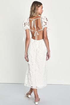 You'll bring all the sweetness to your summer soirees in the Lulus Flourishing Blossoms White 3D Floral Backless Midi Dress! Gorgeous lace-inspired fabric has a pattern of cutouts and floral embroidery as it shapes this dreamy dress. Sheer puff sleeves boast drawstring ties at the cuffs and frame a bodice with a deep V-neckline and a flirty open back, crossed by a single tie. Banded waist tops an A-line skirt that falls to a midi hem. Three-dimensional applique flowers throughout add a lush fini Spring Backless Dresses For Garden Party, Backless Dress For Spring Garden Party, Backless Lace Dress For Garden Party, Spring Lace Backless Dress, Spring Backless Lace Dresses, Backless Lace Dresses For Spring, Flirty Backless Summer Midi Dress, Lace Party Dress With Tie Back, Summer Flirty Lace Dresses