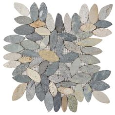 a white and grey mosaic tile with leaves on the bottom, surrounded by small stones