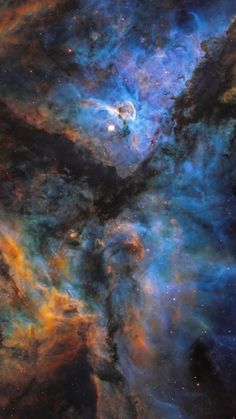 an image of some very pretty stars in the night sky with bright blue and orange colors