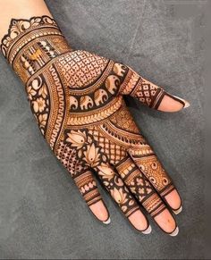 the hand is decorated with intricate designs