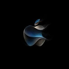 an apple logo is shown in the dark