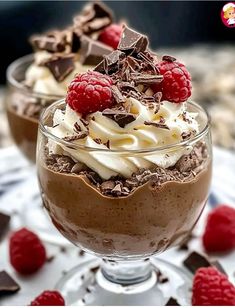 two desserts with chocolate, raspberries and whipped cream