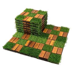 several pieces of wood and grass are stacked on top of each other in the shape of squares