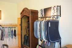 a room filled with lots of different items on display next to a wall mounted coat rack