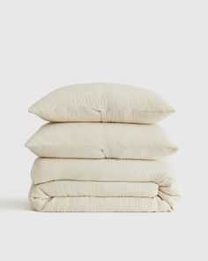 three pillows stacked on top of each other