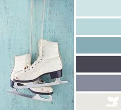 a pair of ice skates hanging on a wall with color swatches in the background