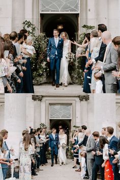 the bride and groom are walking down the aisle