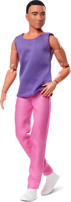 a barbie doll wearing pink pants and a purple top with her hands on her hips